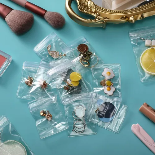 Vista 5 de Outus 100 bolsas de joyería de PVC transparente, pequeñas bolsas de plástico con cierre de cremallera, bolsa de almacenamiento de joyería