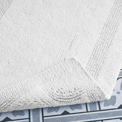 Vista 3 de Laura Ashley Juego de 2 alfombrillas de baño reversibles de algodón, color blanco