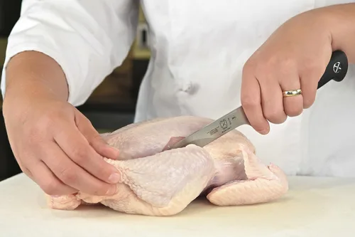 Vista 6 de Cuchillo para carne forjado Mercer Culinary Genesis de 10 pulgadas, Cuchillo rígido, forjado para deshuesar, 15,24 cm, 6", Acero/negro